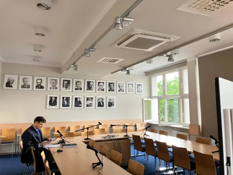 University seminar room lined with portraits